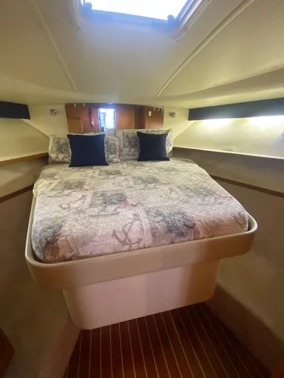 Details Yacht Photos Pics 1998 Tiara Yachts 35 Open cabin interior with bed and pillows.