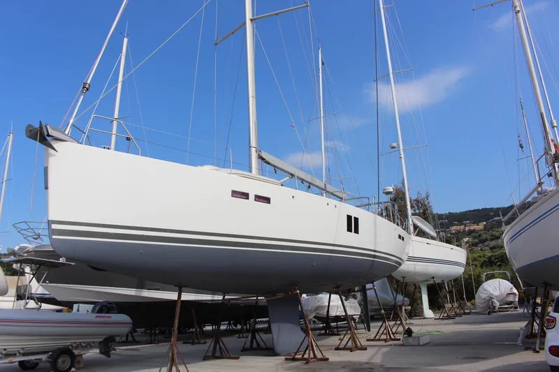  Yacht Photos Pics 2010 Hanse 545 sailboat on stands, clear sky background.