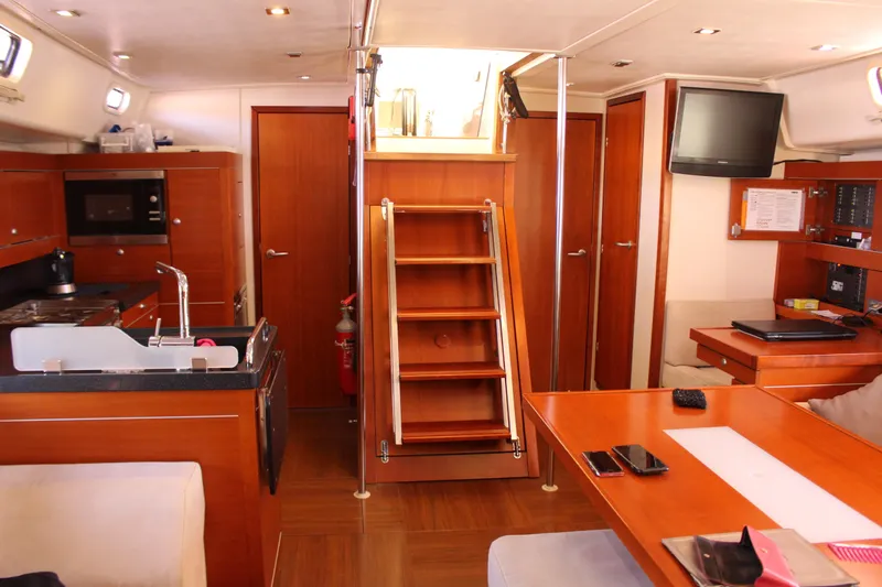  Yacht Photos Pics Interior of 2010 Hanse 545 yacht with modern kitchen and cozy seating area.