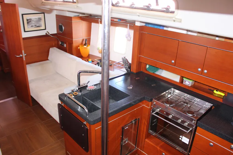  Yacht Photos Pics Interior of 2010 Hanse 545 yacht with modern kitchen and cozy seating area.