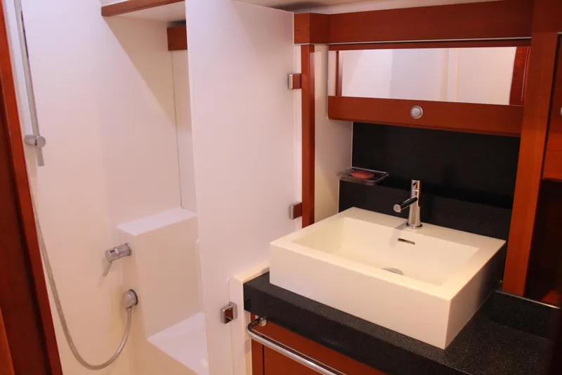  Yacht Photos Pics Luxurious bathroom interior of 2010 Hanse 545 yacht with modern sink and shower.