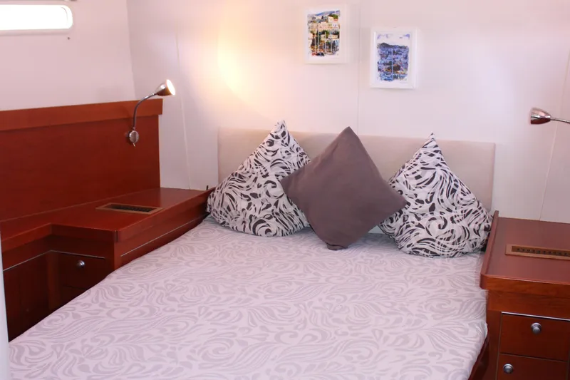  Yacht Photos Pics Cozy bedroom interior on 2010 Hanse 545 yacht with elegant wood furnishings.