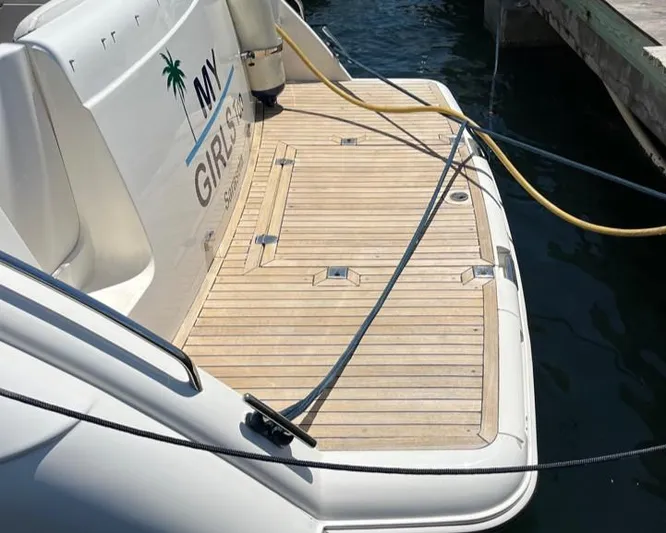My Girls Too Yacht Photos Pics 1998 Viking Princess 46 Flybridge Sport Cruiser, teak swim platform, docked at marina.
