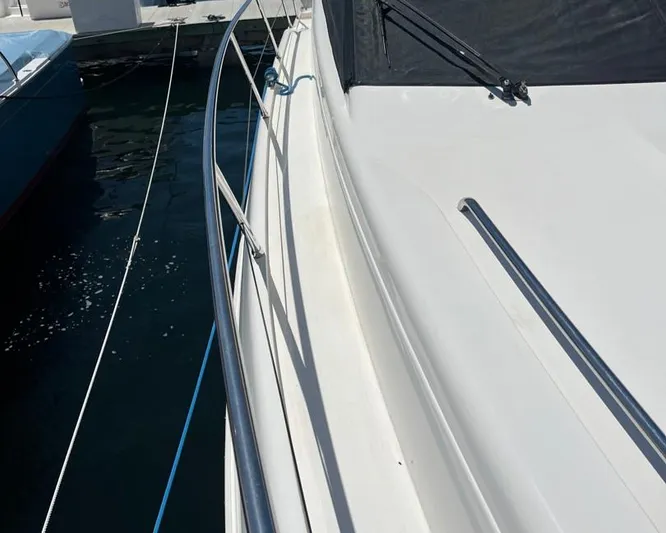 My Girls Too Yacht Photos Pics 1998 Viking Princess 46 Flybridge Sport Cruiser, side deck view with railing.