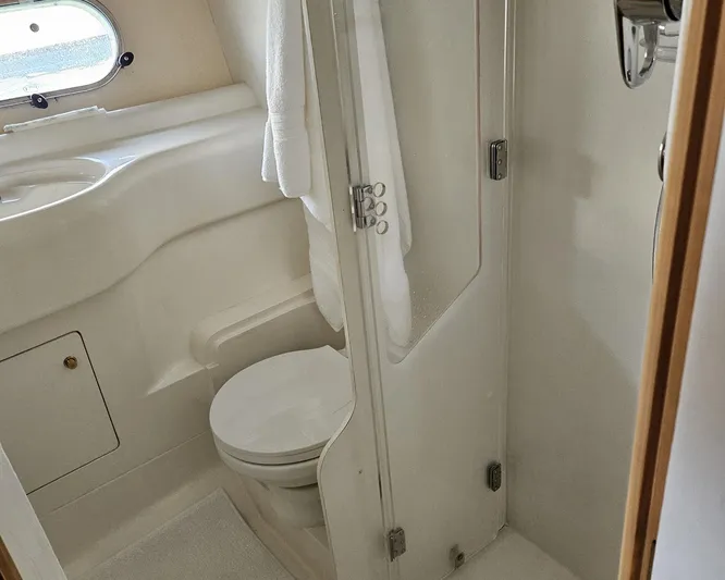 My Girls Too Yacht Photos Pics Bathroom interior of 1998 Viking Princess 46 Flybridge Sport Cruiser, featuring toilet and shower.