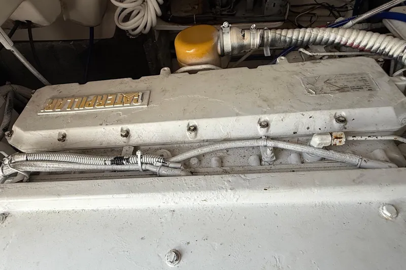  Yacht Photos Pics Engine compartment of a 1999 Ocean Yachts 40 Express, featuring a Caterpillar engine.
