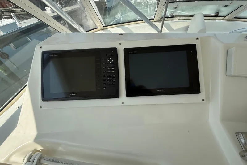  Yacht Photos Pics Garmin navigation displays on 1999 Ocean Yachts 40 Express boat dashboard.