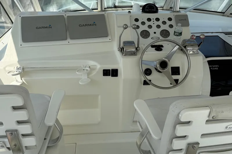  Yacht Photos Pics Cockpit of 1999 Ocean Yachts 40 Express with Garmin navigation system and steering wheel.