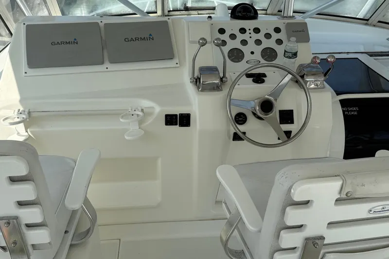  Yacht Photos Pics 1999 Ocean Yachts 40 Express helm with Garmin displays and dual captain chairs.