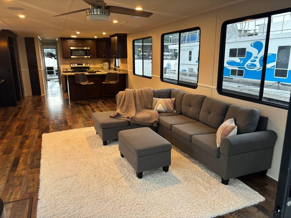 Luxurious 1992 Lakeview houseboat interior with modern kitchen, cozy living area, and stylish decor.