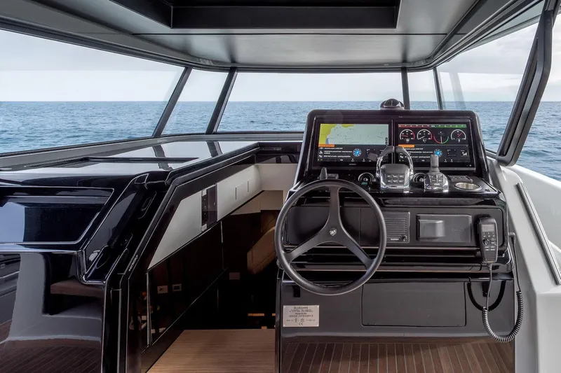  Yacht Photos Pics 2024 Bluegame BG54 yacht helm with modern navigation controls and ocean view.