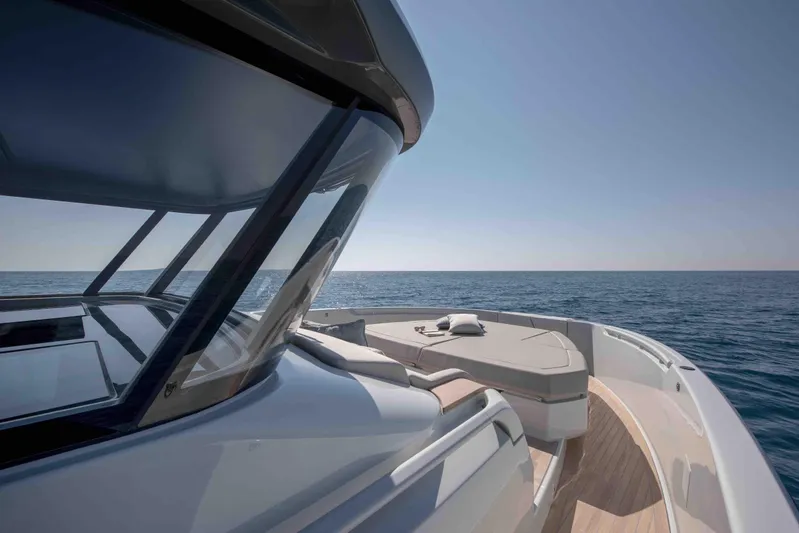  Yacht Photos Pics 2024 Bluegame BG54 yacht on open sea, showcasing sleek design and spacious deck.