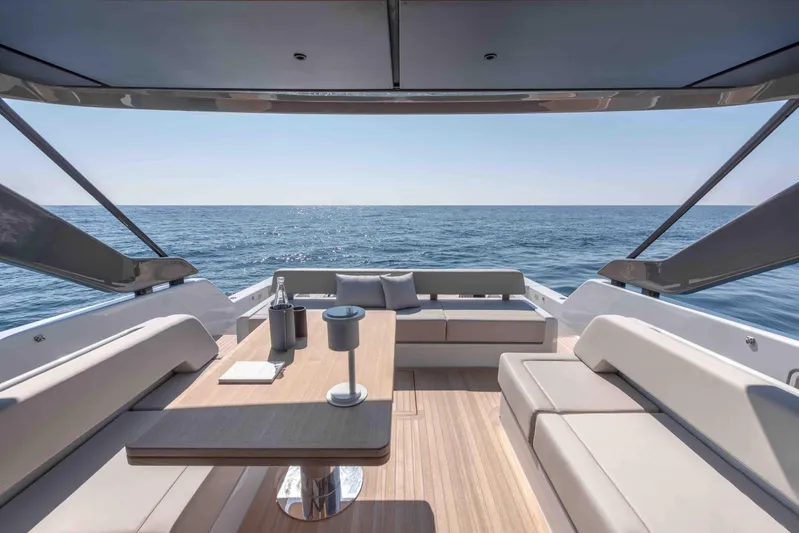  Yacht Photos Pics Luxurious 2024 Bluegame BG54 yacht deck with elegant seating and ocean view.