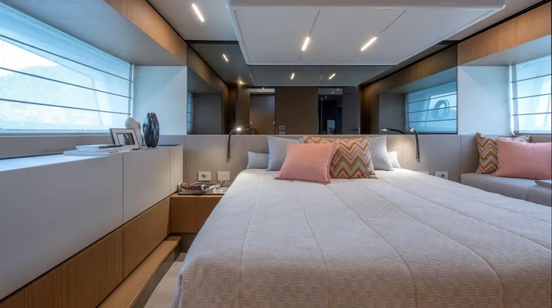  Yacht Photos Pics Luxurious interior of 2024 Bluegame BG54 yacht bedroom with modern decor and soft lighting.