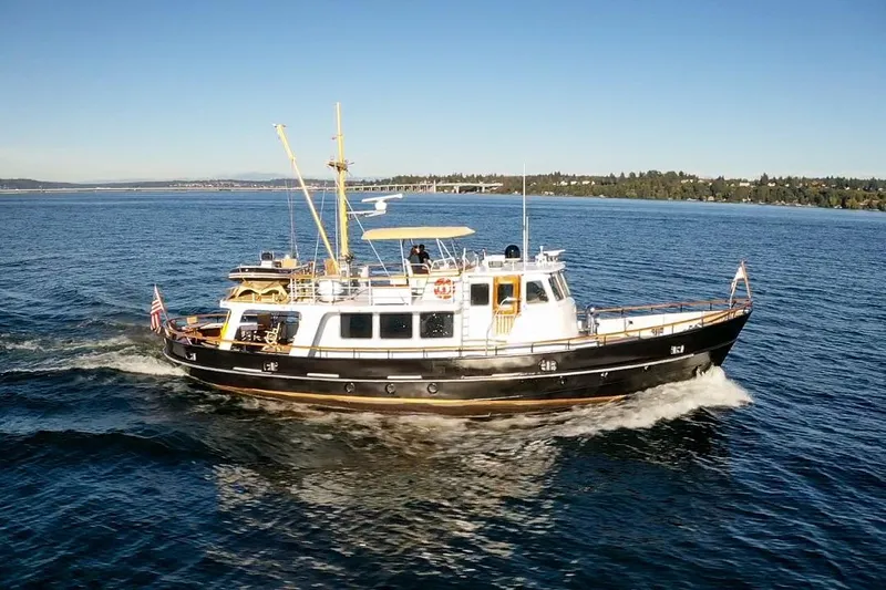  Yacht Photos Pics A 1974 Doggersbank 63 yacht cruising on a sunny day in open waters.