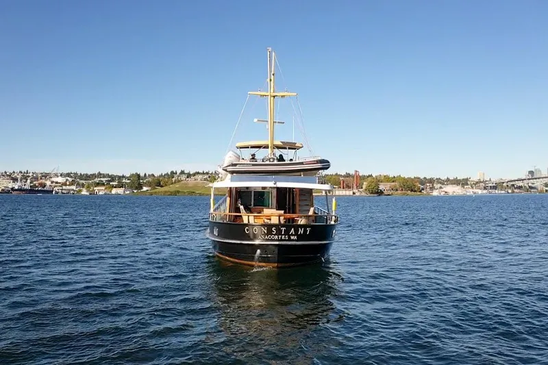  Yacht Photos Pics Vintage 1974 Doggersbank 63 yacht on calm water under clear blue sky.