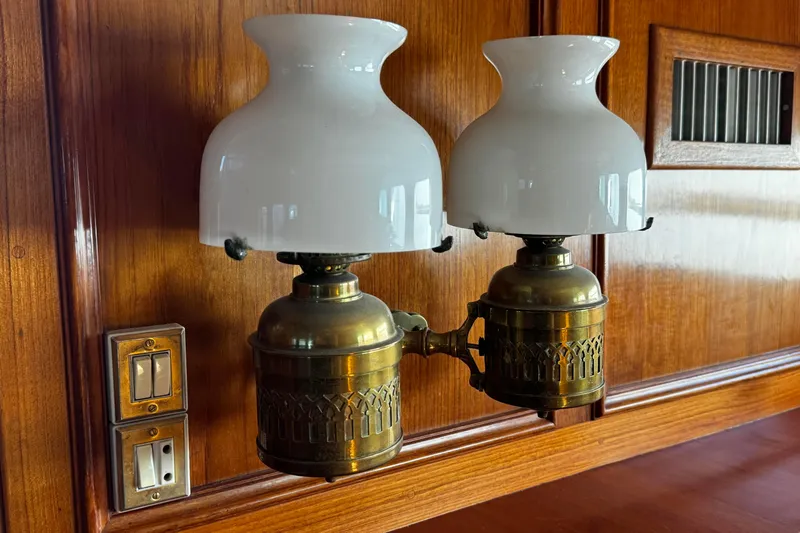  Yacht Photos Pics Vintage brass wall lamps with white glass shades on wooden paneling, Doggersbank 63, 1974.