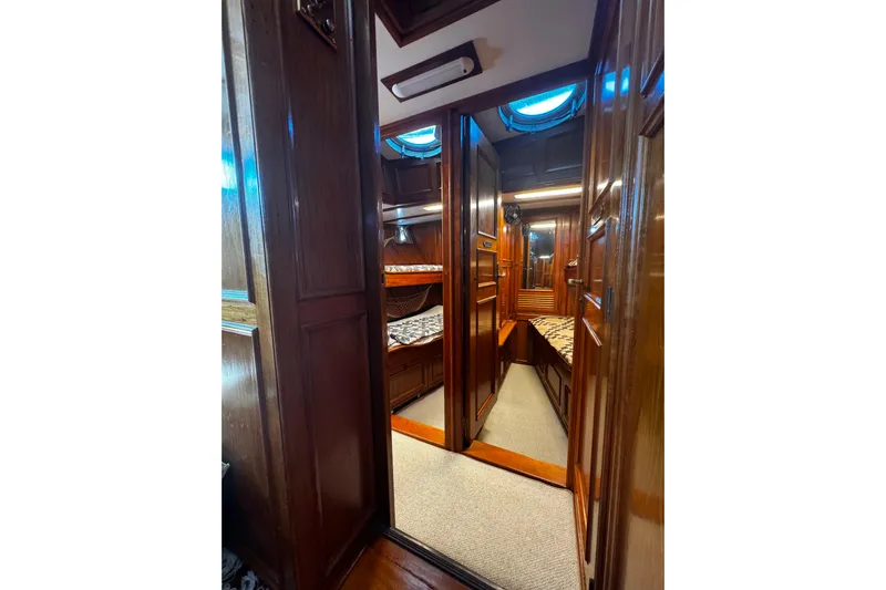  Yacht Photos Pics Interior of 1974 Doggersbank 63 yacht with wooden paneling and cozy cabin.