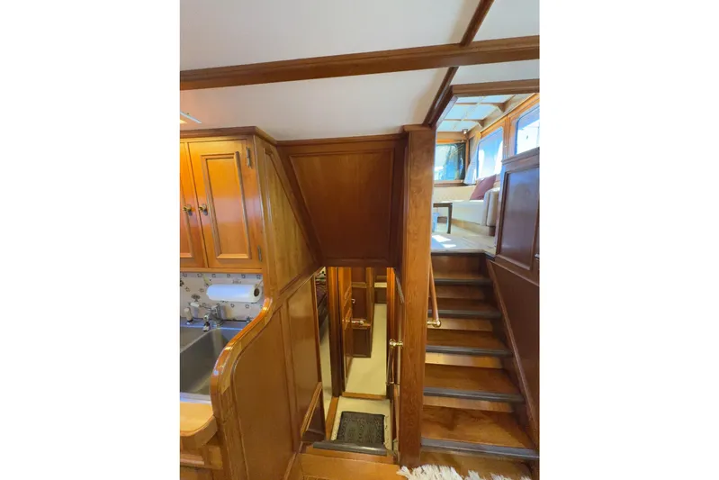  Yacht Photos Pics Interior of 1974 Doggersbank 63 yacht with wooden stairs and cabinetry.