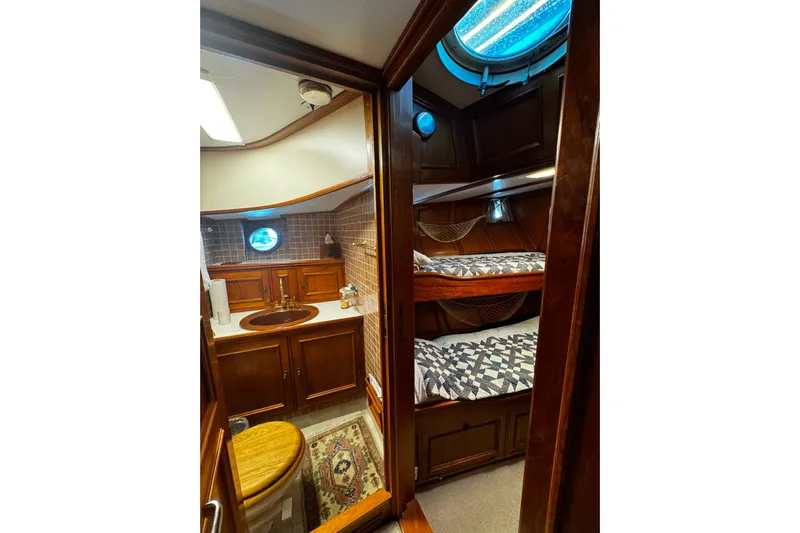  Yacht Photos Pics Cozy 1974 Doggersbank 63 yacht interior with wooden cabinetry and bunk beds.