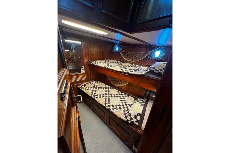  Yacht Photos Pics Cozy wooden cabin with bunk beds on a 1974 Doggersbank 63 yacht.