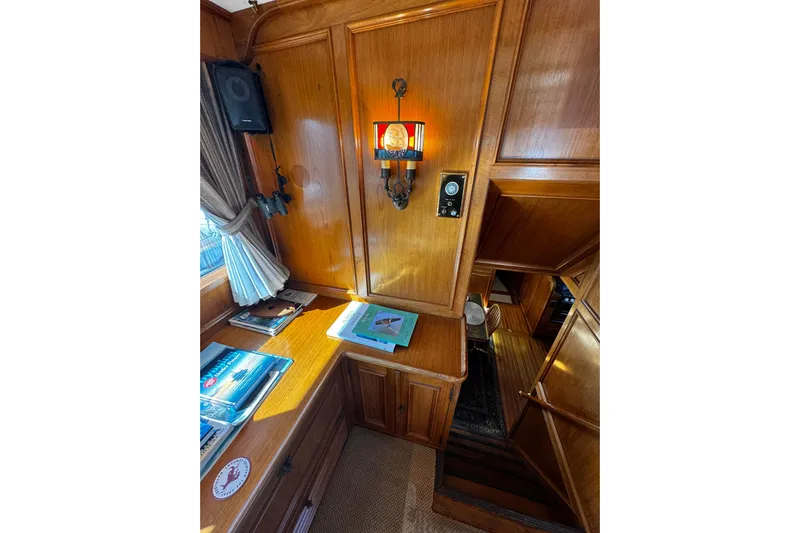  Yacht Photos Pics Interior of 1974 Doggersbank 63 yacht with wooden paneling and nautical decor.