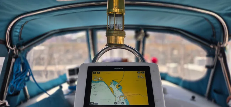  Yacht Photos Pics 1987 Tayana Center Cockpit sailboat interior with navigation display and blue canopy.
