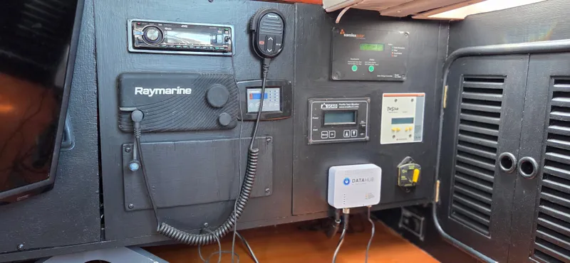  Yacht Photos Pics Control panel of 1987 Tayana Center Cockpit with navigation and communication equipment.