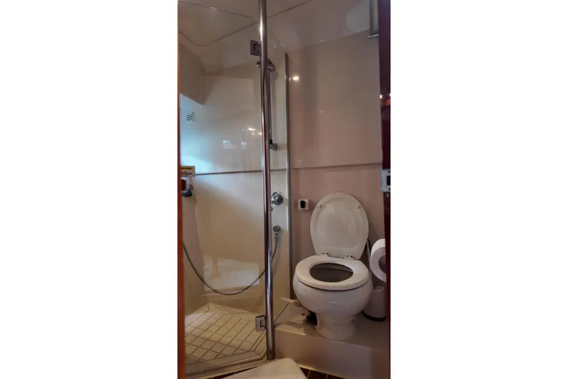  Yacht Photos Pics Bathroom interior of 2009 Riviera 4700 Sport Yacht with shower and toilet.
