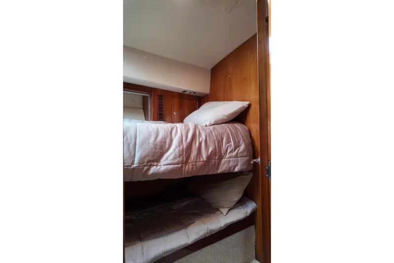  Yacht Photos Pics Interior of 2009 Riviera 4700 Sport Yacht with cozy bunk beds.