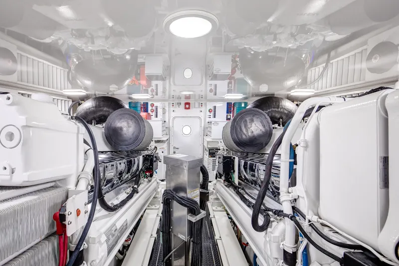 Pipe Dreamer Yacht Photos Pics Engine room of 2015 Viking 70 Convertible yacht, showcasing advanced machinery and equipment.