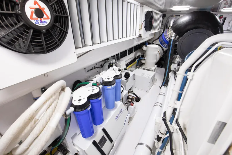 Pipe Dreamer Yacht Photos Pics Engine room of 2015 Viking 70 Convertible yacht with filtration system and ventilation.