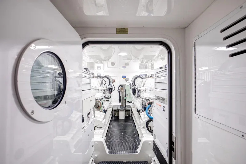 Pipe Dreamer Yacht Photos Pics Engine room of 2015 Viking 70 Convertible yacht, showcasing advanced machinery and clean design.