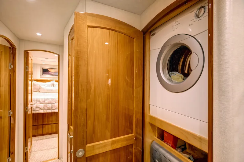 Pipe Dreamer Yacht Photos Pics Laundry area and bedroom in 2015 Viking 70 Convertible yacht interior.
