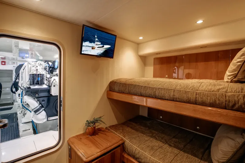 Pipe Dreamer Yacht Photos Pics Interior of 2015 Viking 70 Convertible yacht with bunk beds and engine room view.