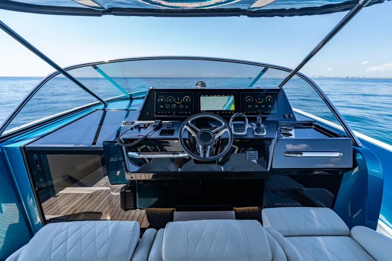  Yacht Photos Pics 2024 Solaris Power 52 Open yacht cockpit with modern controls and ocean view.