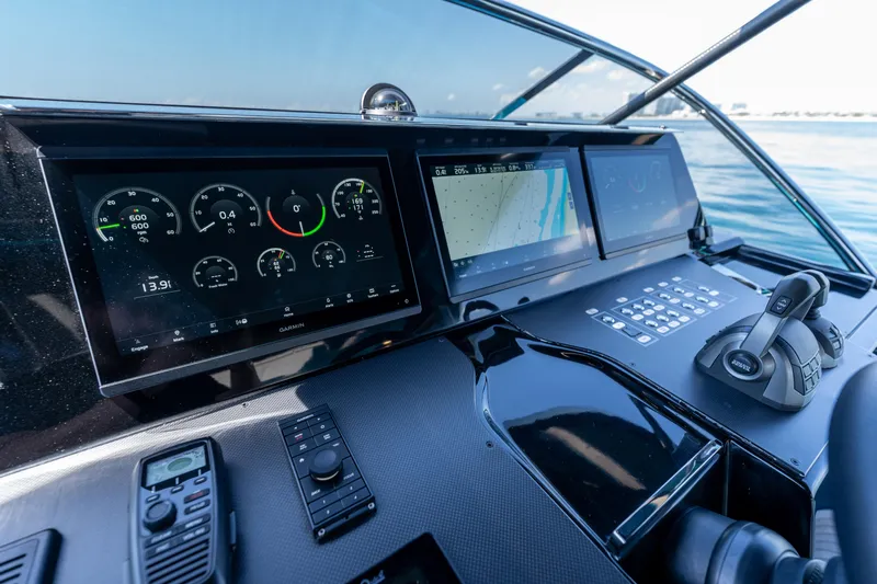  Yacht Photos Pics Control panel of 2024 Solaris Power 52 Open yacht with navigation screens and controls.