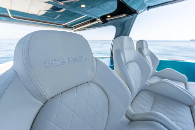  Yacht Photos Pics Luxurious seating on 2024 Solaris Power 52 Open yacht with ocean view.