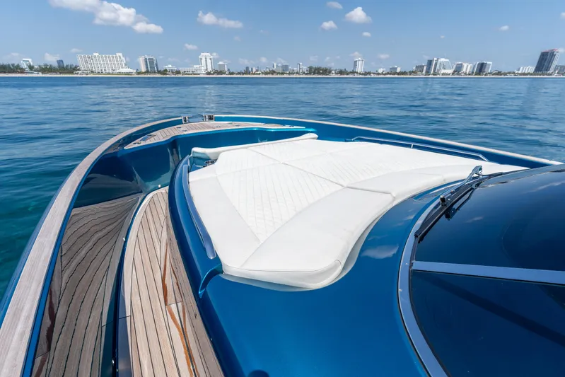  Yacht Photos Pics 2024 Solaris Power 52 Open yacht with sleek deck and luxurious seating on calm waters.