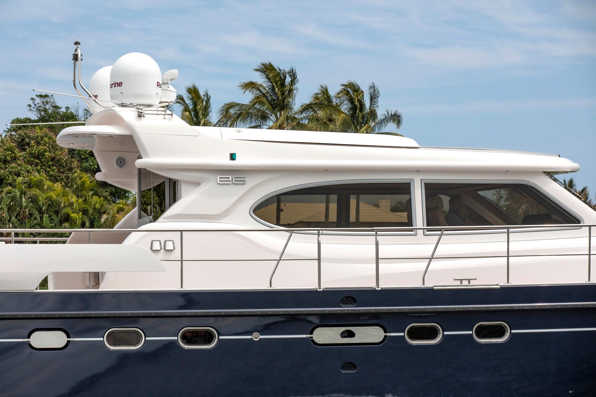 2025 Elling E6 Ultimate yacht, sleek design, side view, tropical background.