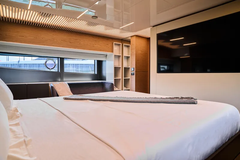  Yacht Photos Pics Luxurious bedroom interior of 2023 Ferretti Yachts 920 with modern design and large windows.