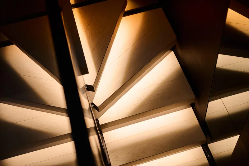  Yacht Photos Pics Illuminated wooden staircase detail on 2023 Ferretti Yachts 920.