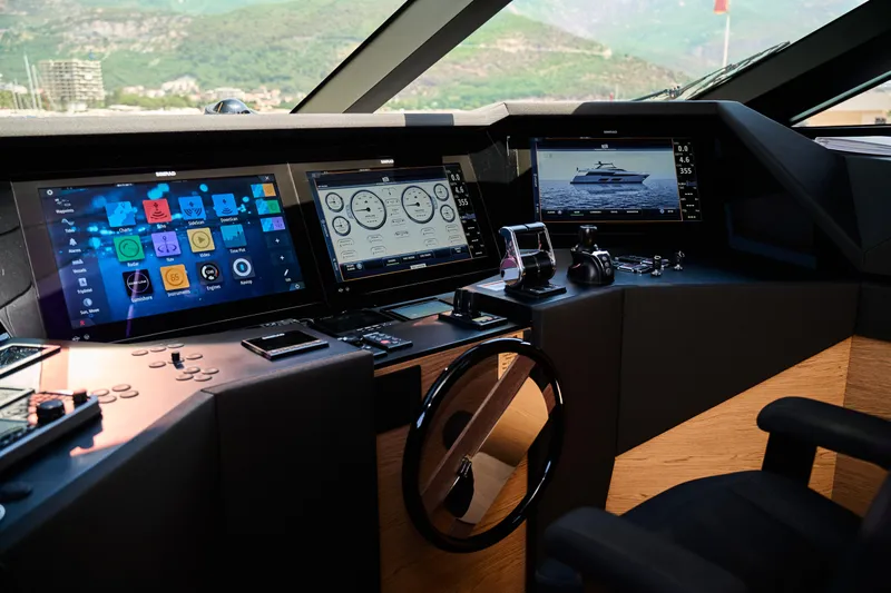  Yacht Photos Pics Cockpit of 2023 Ferretti Yachts 920 with advanced navigation displays and controls.