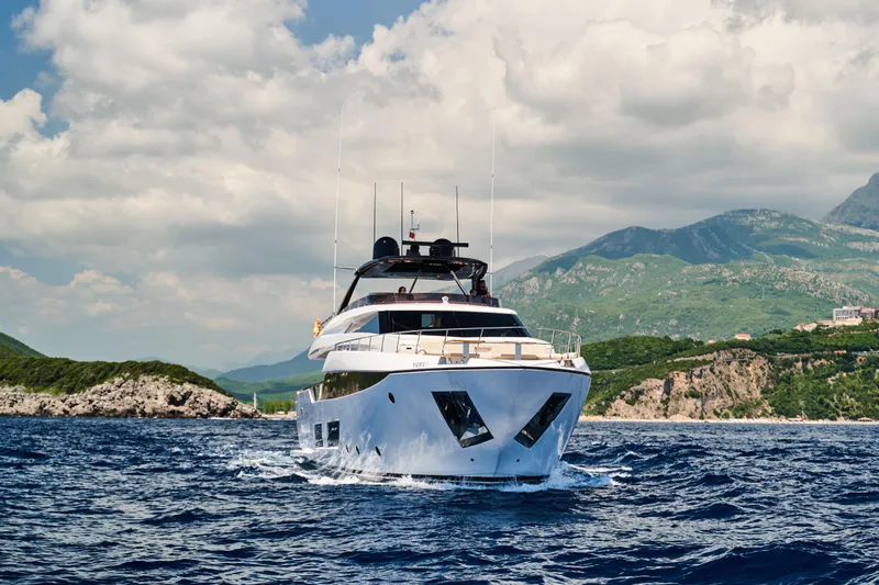  Yacht Photos Pics Luxurious 2023 Ferretti Yachts 920 cruising in scenic coastal waters.