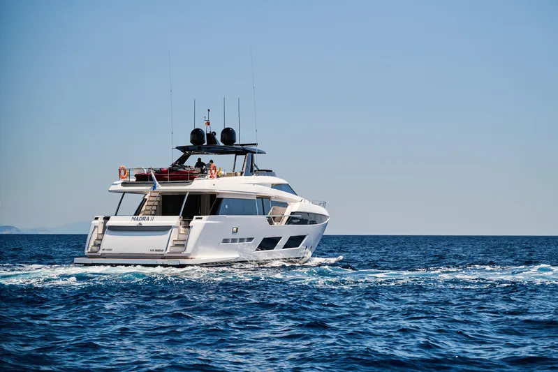  Yacht Photos Pics 2023 Ferretti Yachts 920 cruising on open sea under clear blue sky.