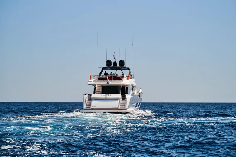  Yacht Photos Pics 2023 Ferretti Yachts 920 cruising on open sea under clear blue sky.