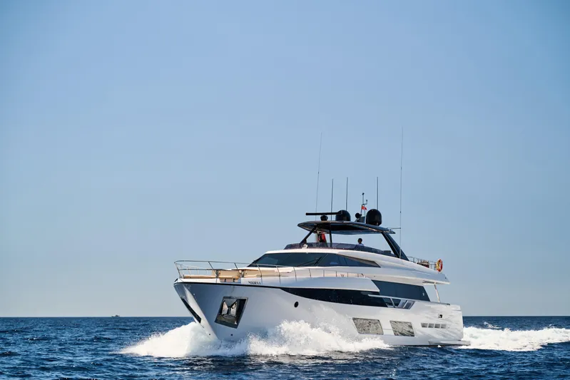  Yacht Photos Pics 2023 Ferretti Yachts 920 cruising on open sea under clear blue sky.