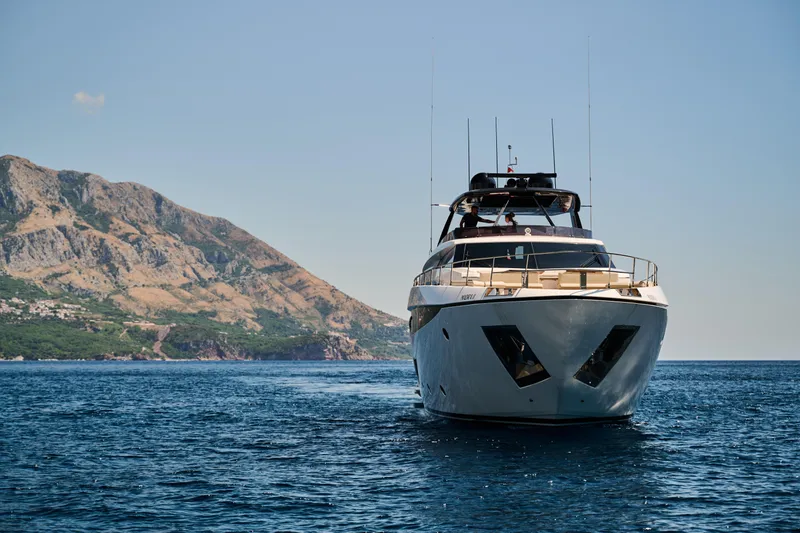  Yacht Photos Pics 2023 Ferretti Yachts 920 cruising near scenic coastal mountains.