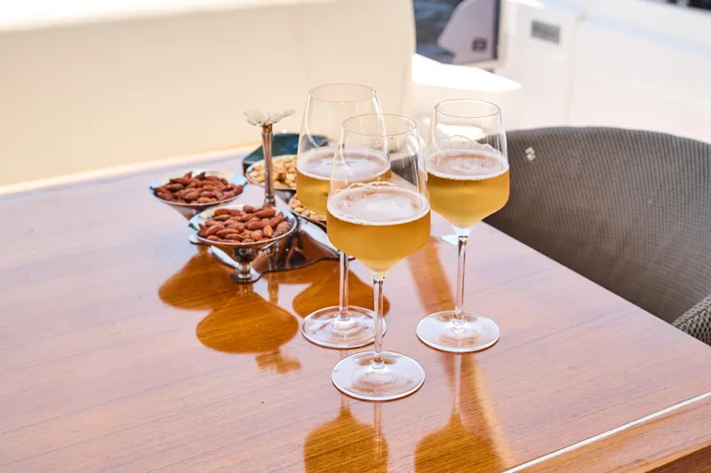  Yacht Photos Pics Glasses of champagne and snacks on Ferretti Yachts 920, 2023 model.