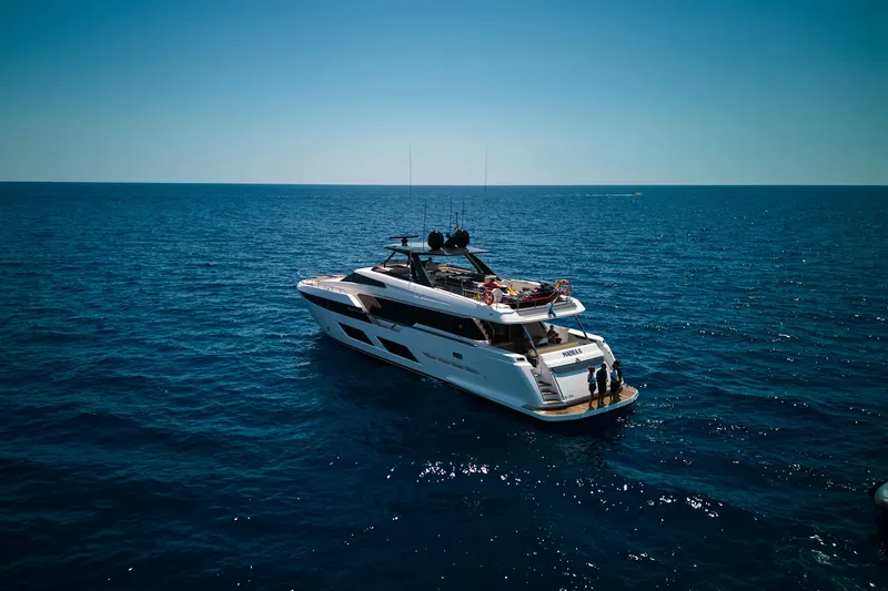  Yacht Photos Pics Luxury 2023 Ferretti Yachts 920 cruising on open sea under clear blue sky.